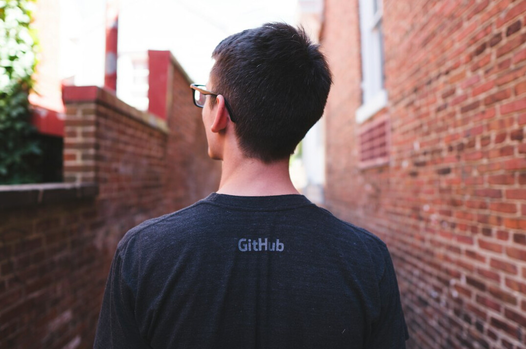 programmer reviewing code on github